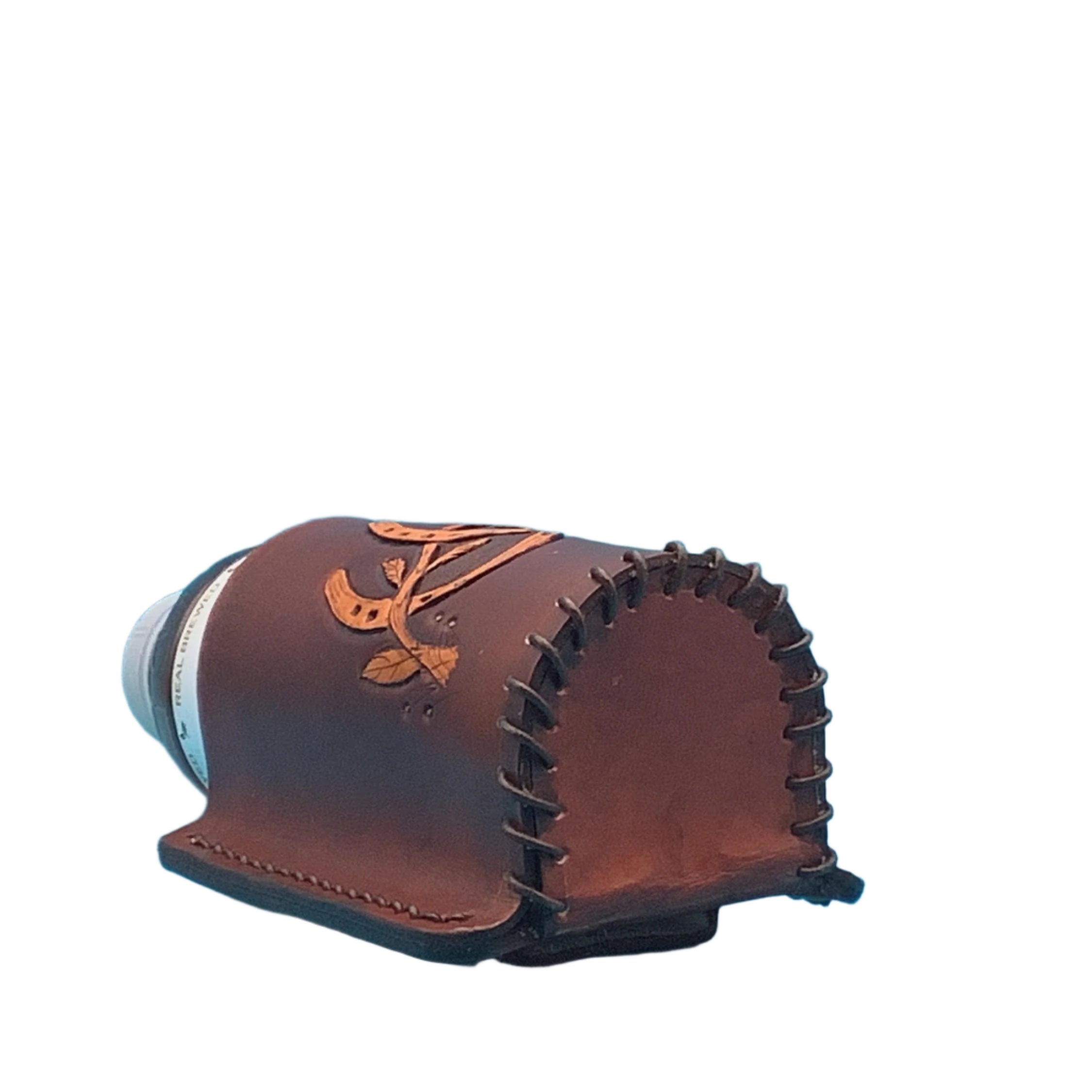 The bottom of a medium brown leather saddle bottle holder with hand tooled horseshoes.