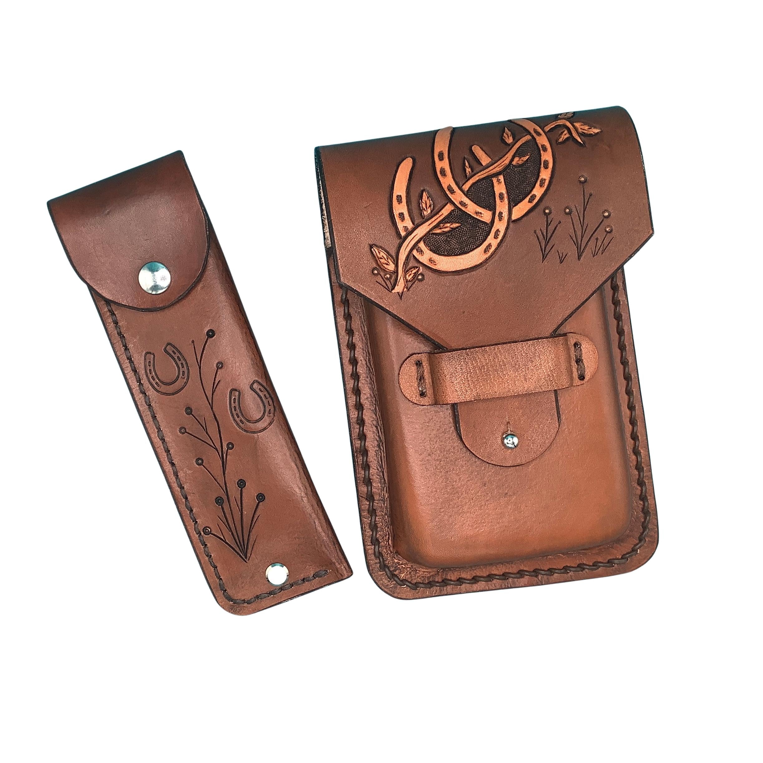 A medium brown phone holder and hoof pick holder for saddle billet with hand tooled horseshoes.