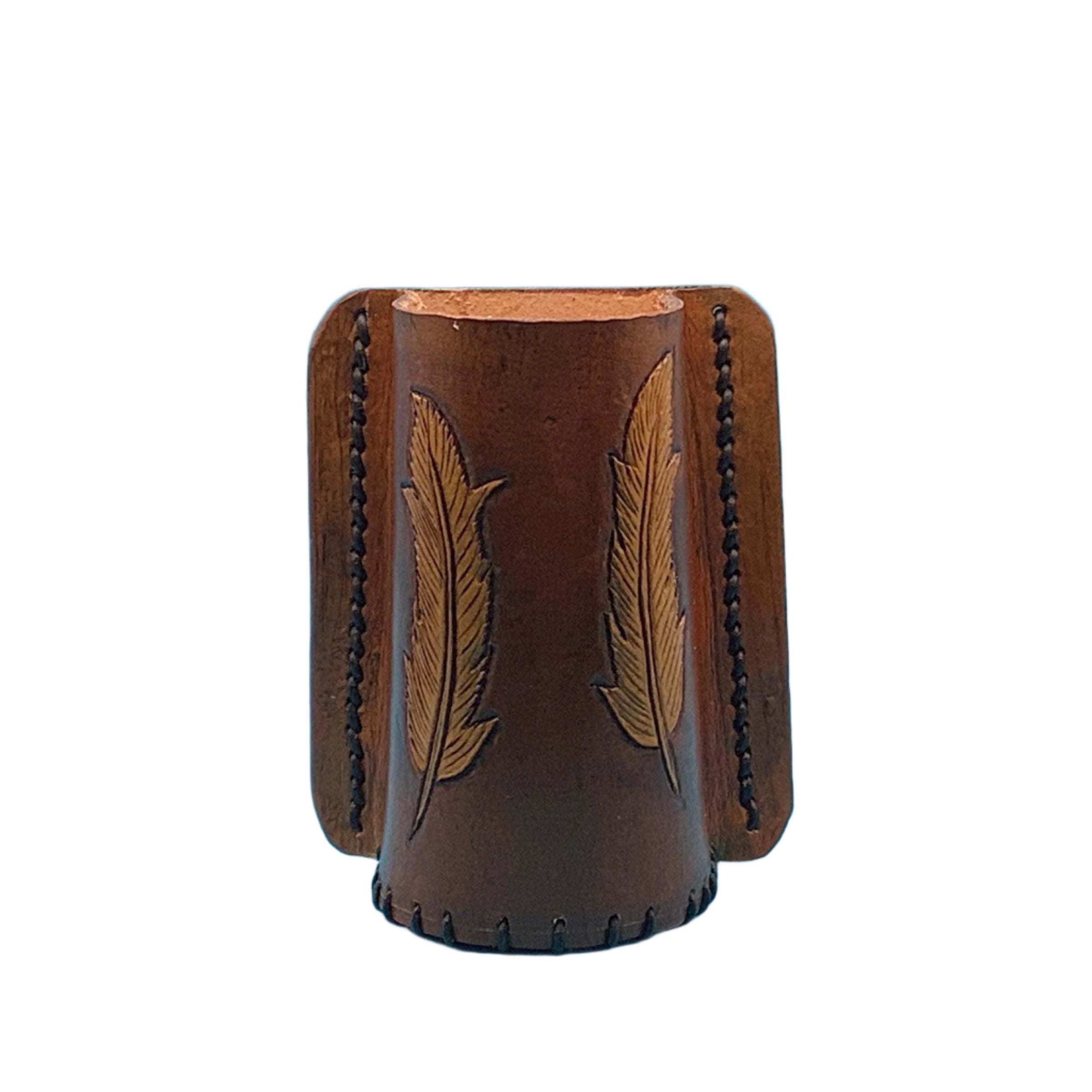 A mahogany leather bottle holder with hand tooled feathers