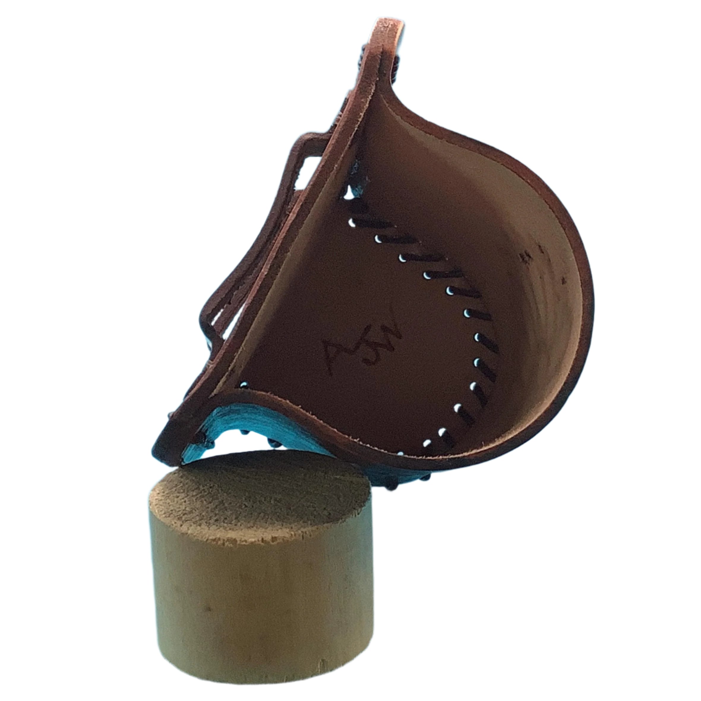 The inside of a mahogany leather bottle holder for a saddle rear cinch.