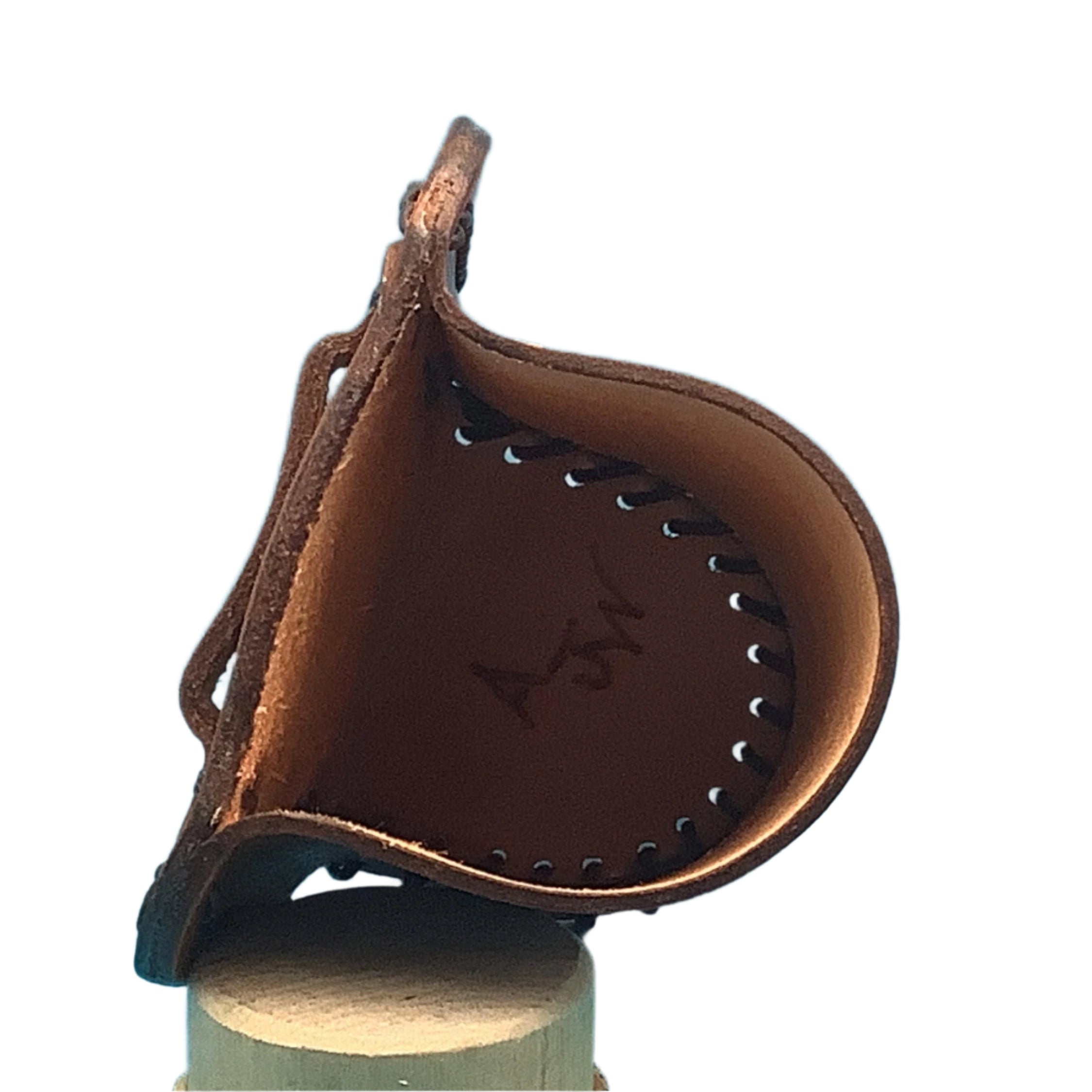 The inside of a saddle bottle holder.