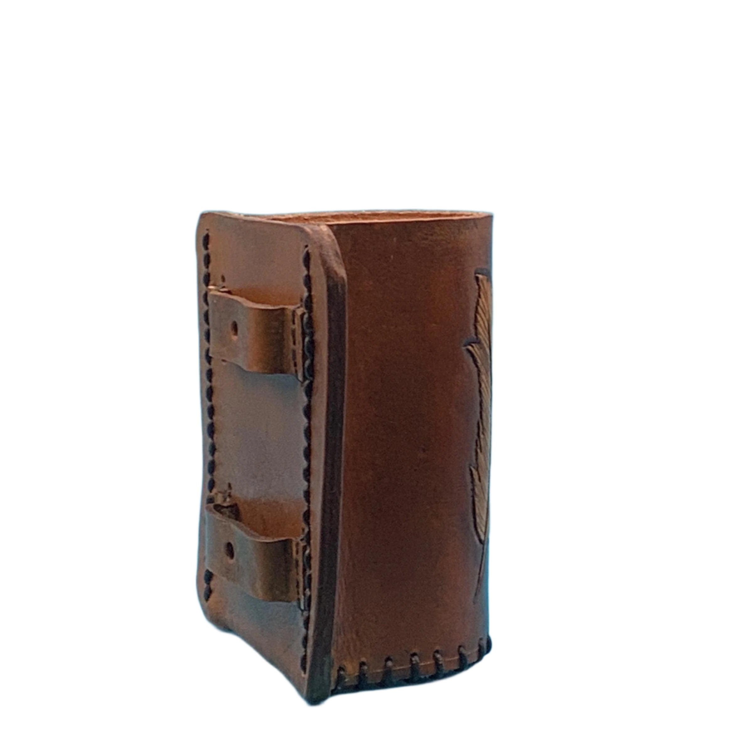 Side view of a  mahogany leather bottle holder with hand tooled feathers.