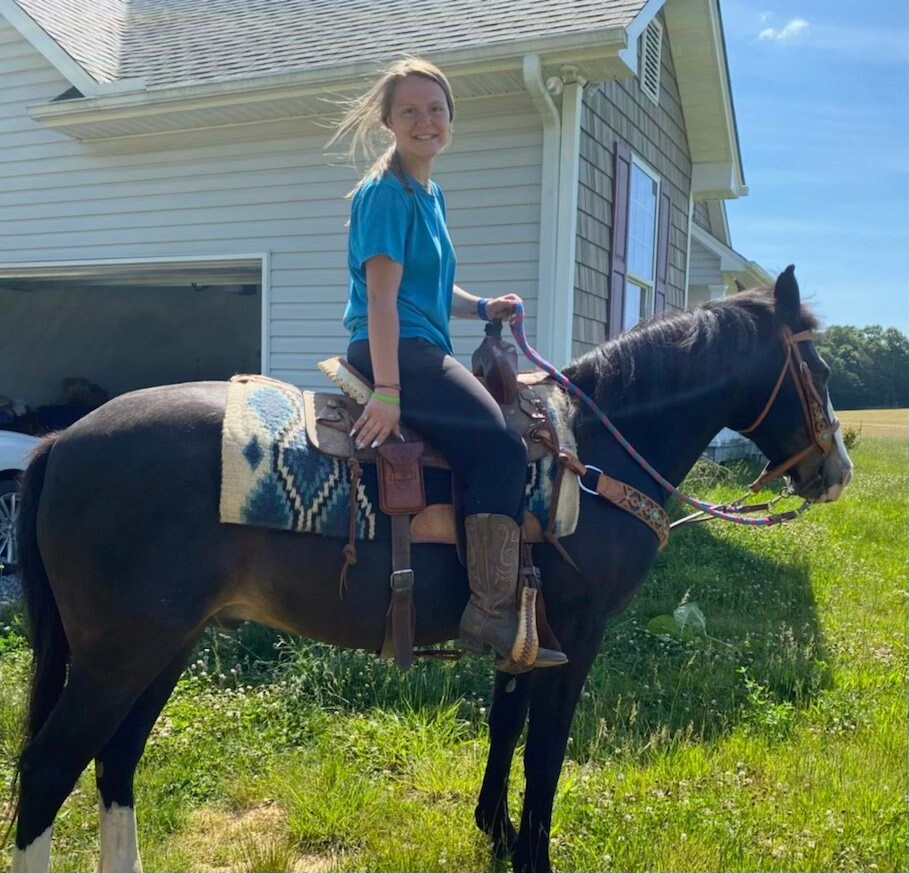 A rider using a saddle phone holder.