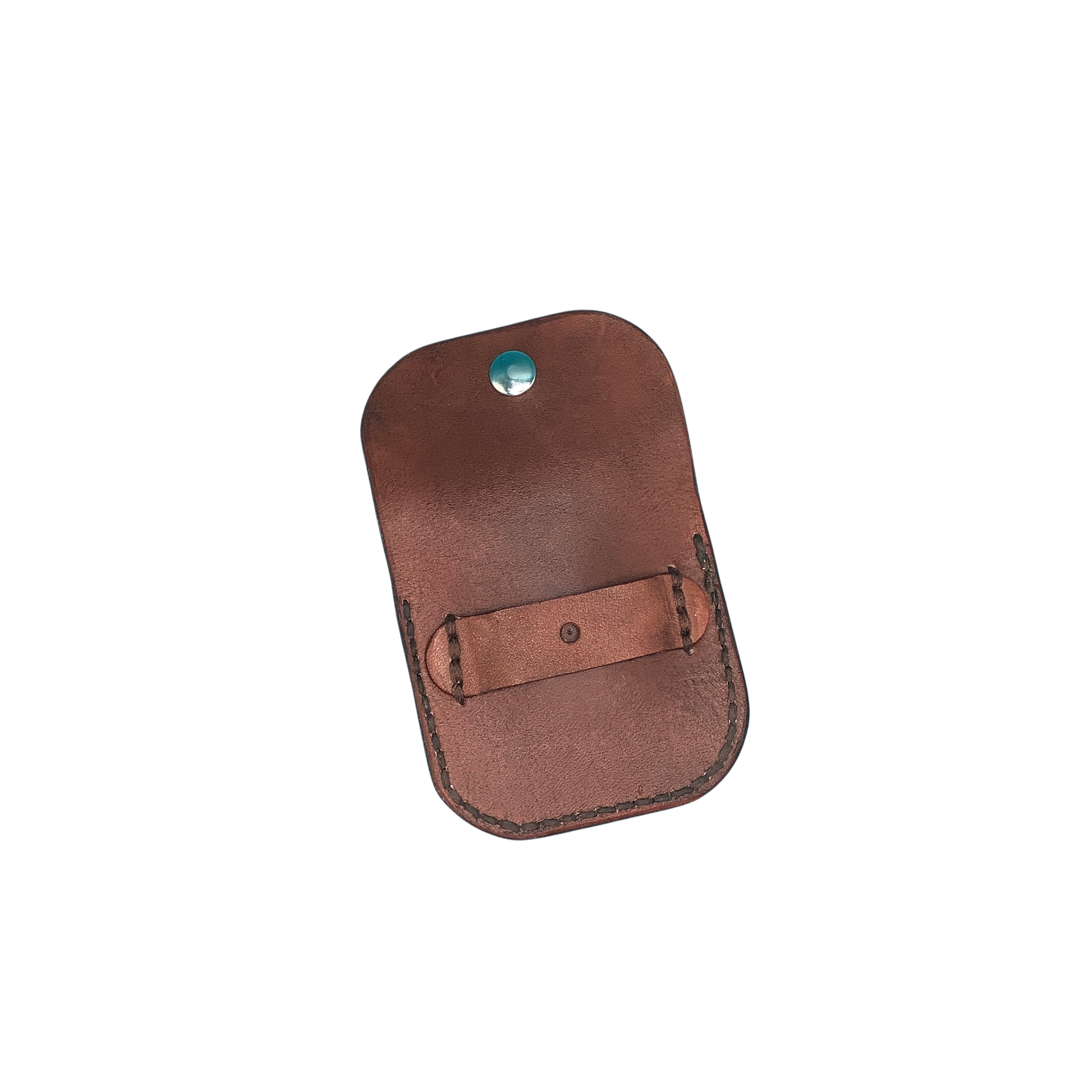 A hand tooled mahogany leather folding hoof pick holder showing the strap on the back that holds it to the rear cinch.