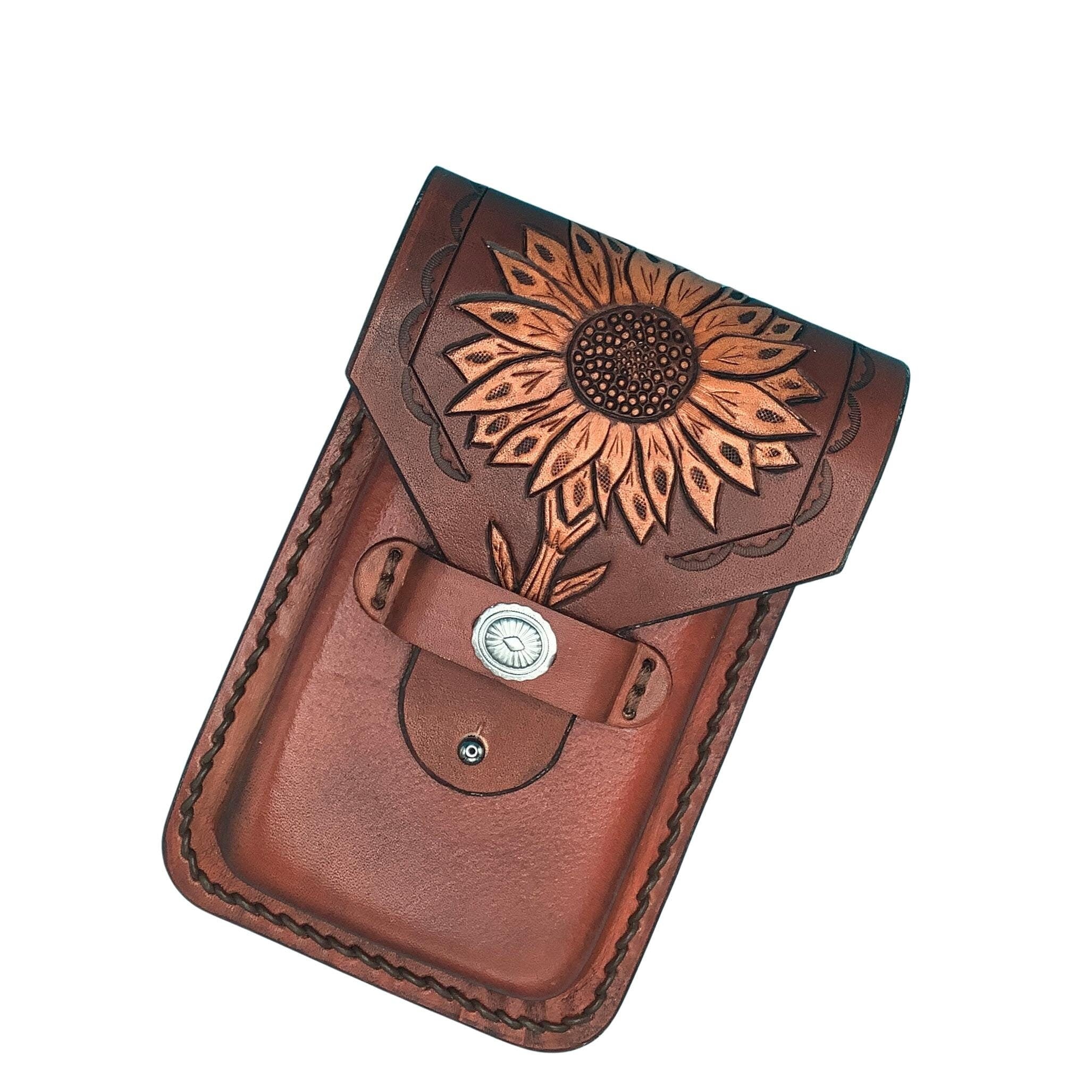 Mahogany leather phone holder for a saddle billet with hand tooled sunflower.