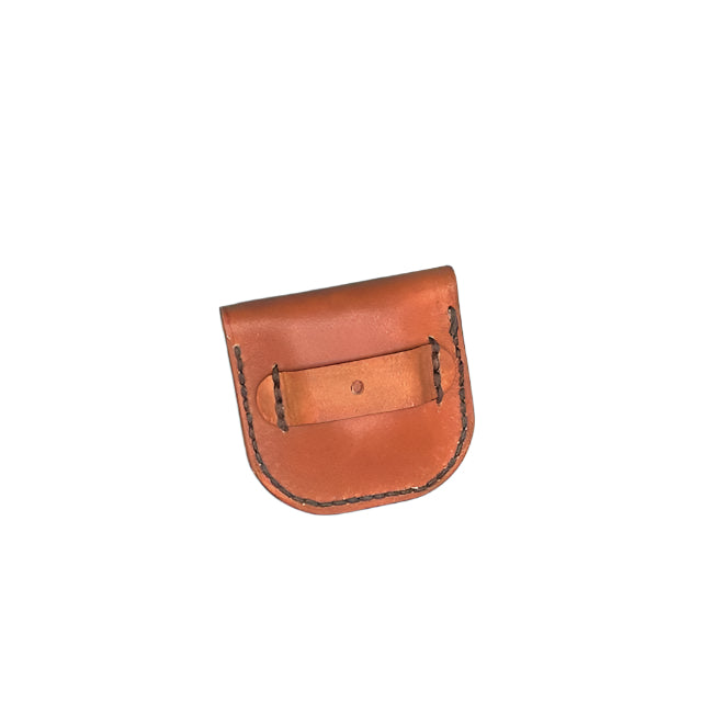 The back of a leather folding hoof pick holder showing the straps that attach it to the rear cinch.