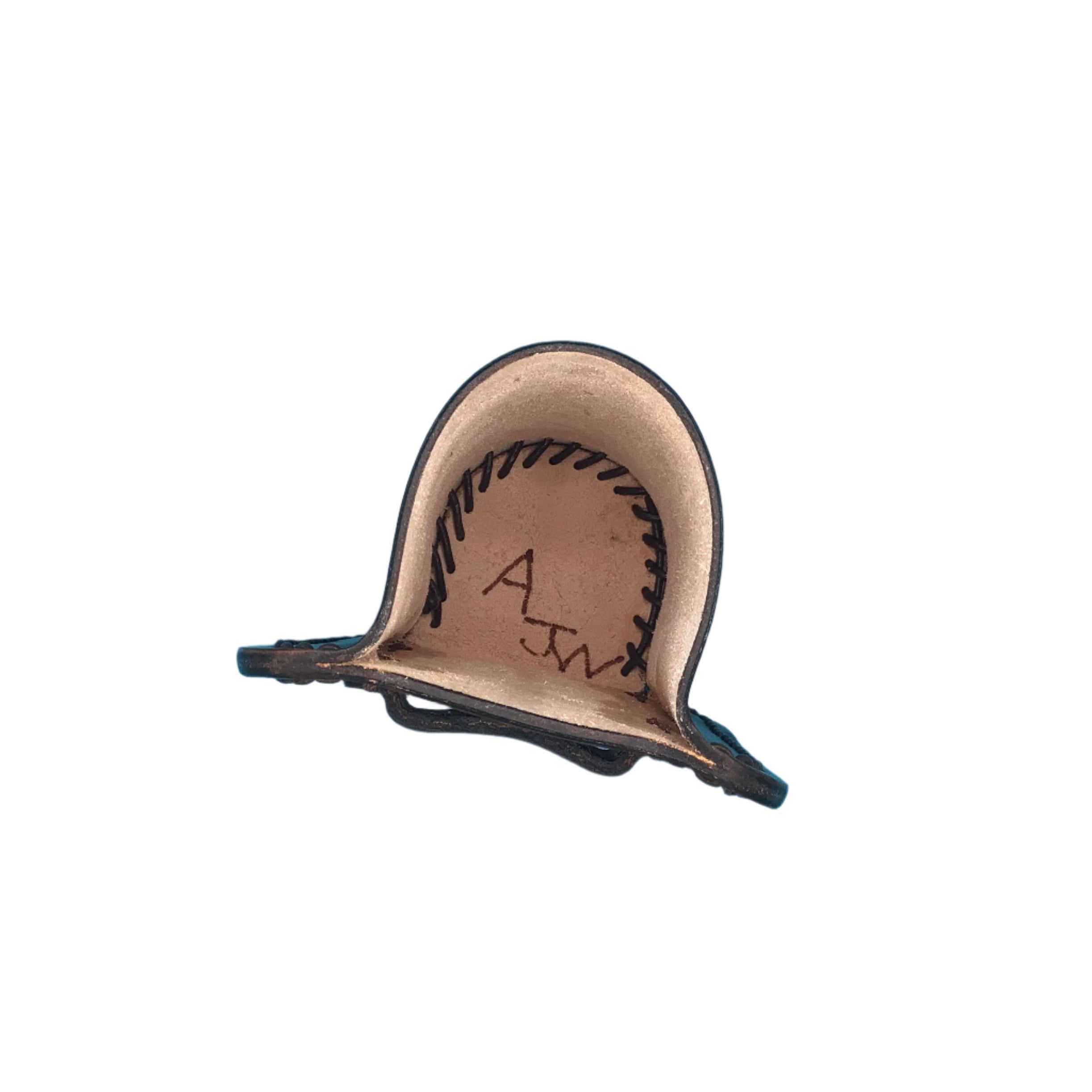 The inside of a dark brown leather bottle holder for saddle billet strap.