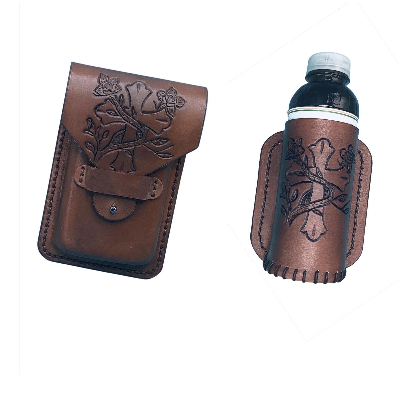 A medium brown leather phone holder and drink holder for saddle billet with hand tooled cross and vine pattern.