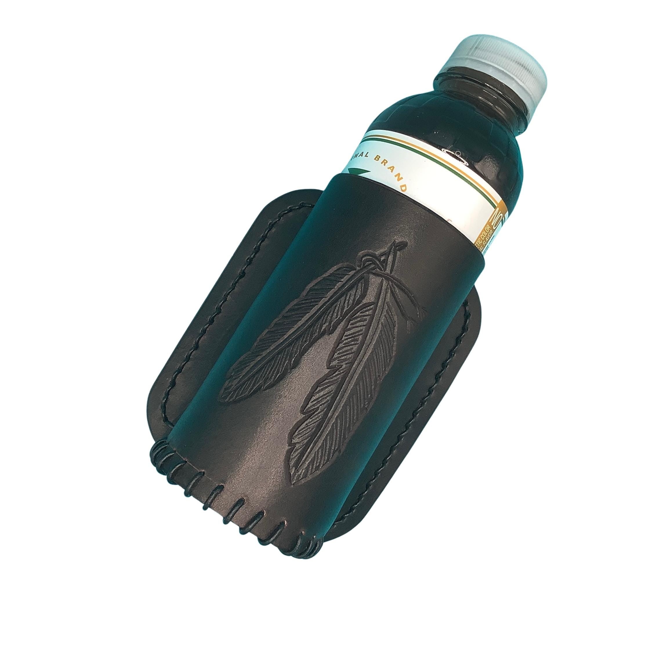 Dark chocolate bottle holder for saddle billet strap with hand tooled feathers.