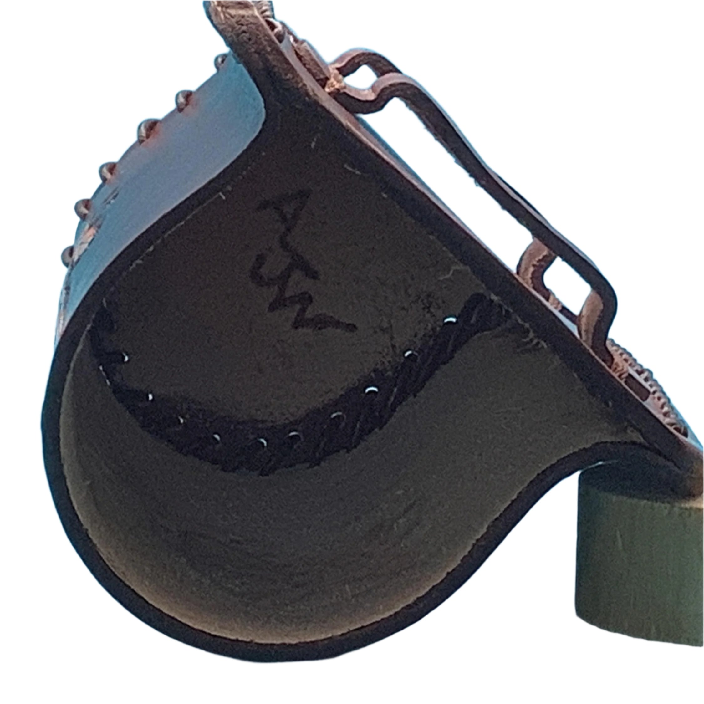 The inside of a leather bottle holder for saddle rear cinch.