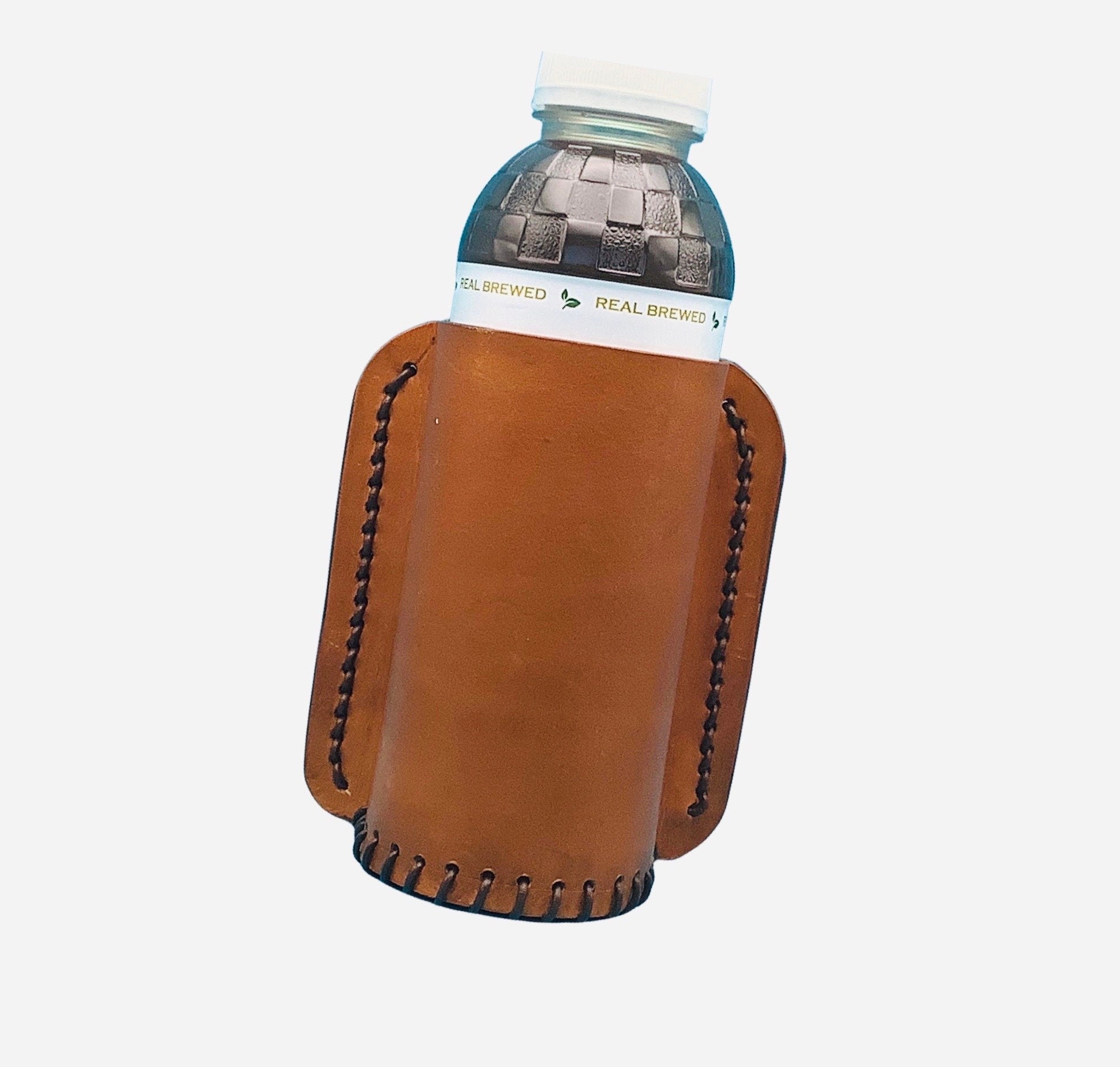 A tan drink holder for saddle billet strap.