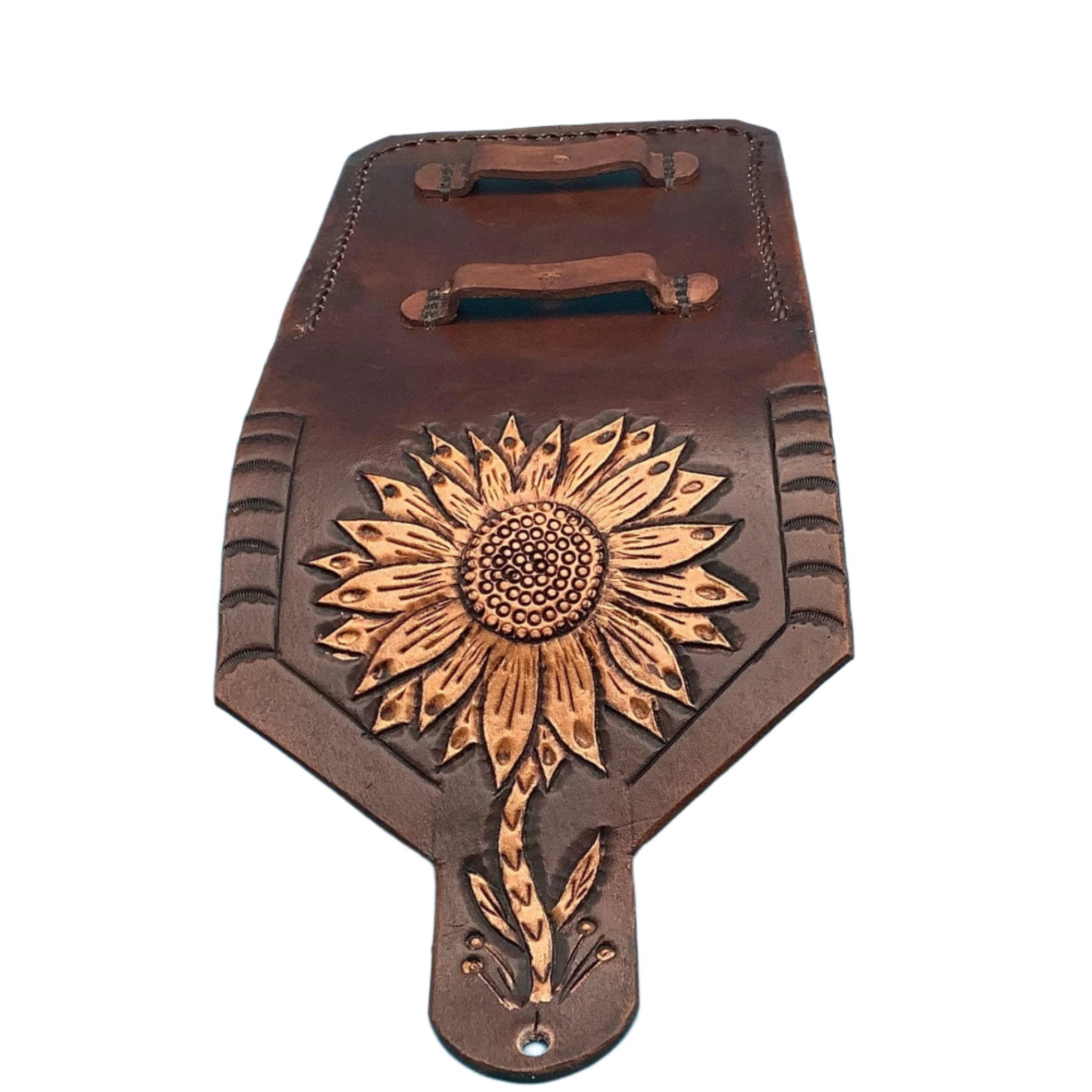 Full view of a mahogany leather phone case for saddle billet with hand tooled sunflower.