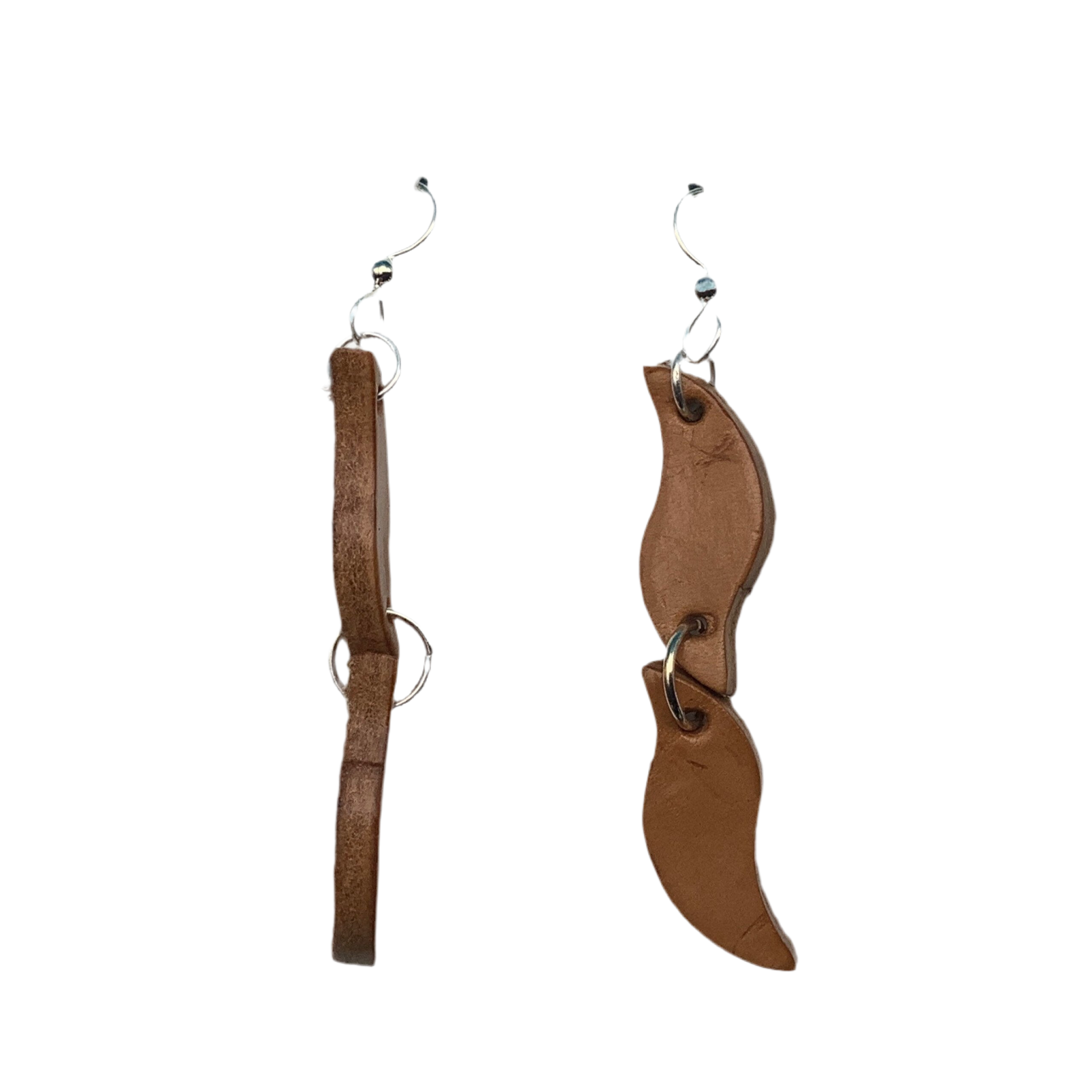 A side view of long leather earrings on sterling silver ear wires.  