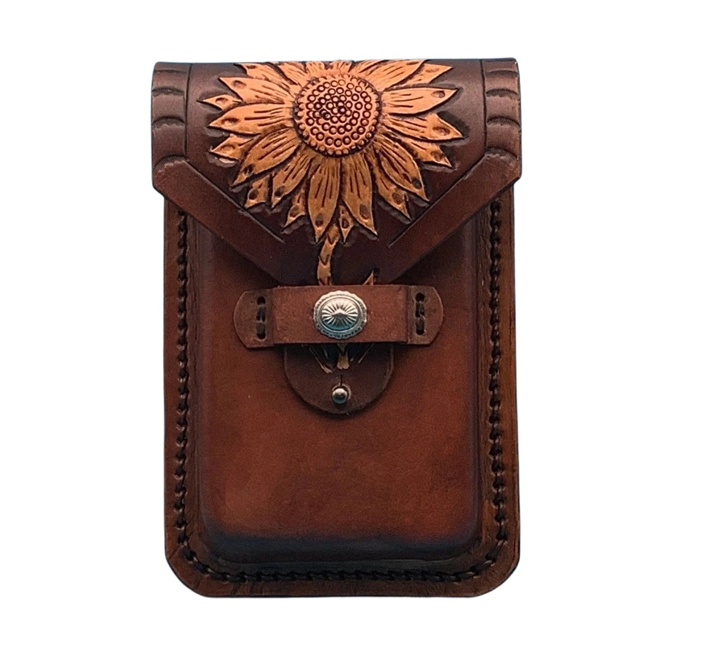 A mahogany leather phone case for saddle billet with hand tooled sunflower.