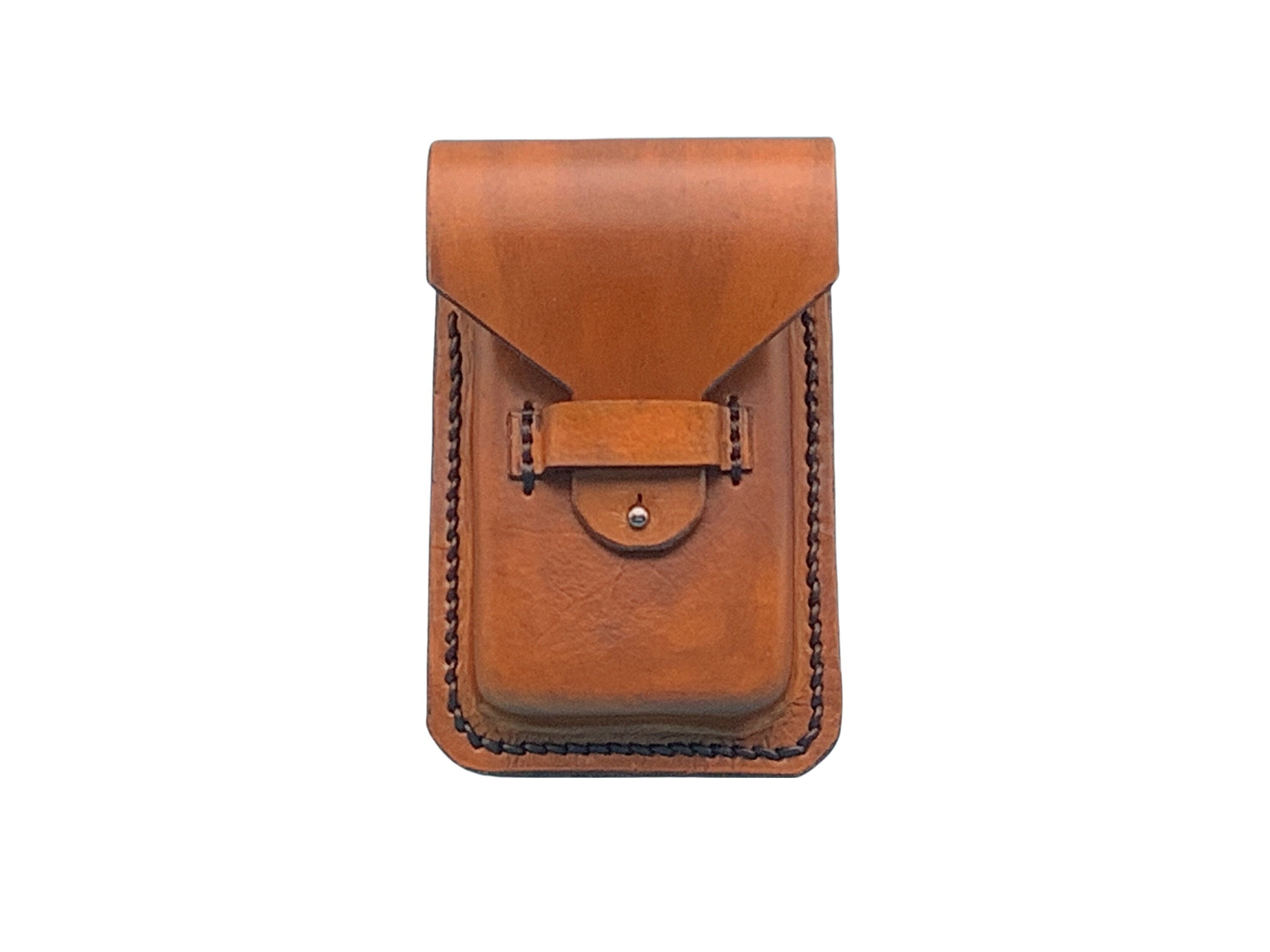 A tan leather phone holder for saddle billet strap.