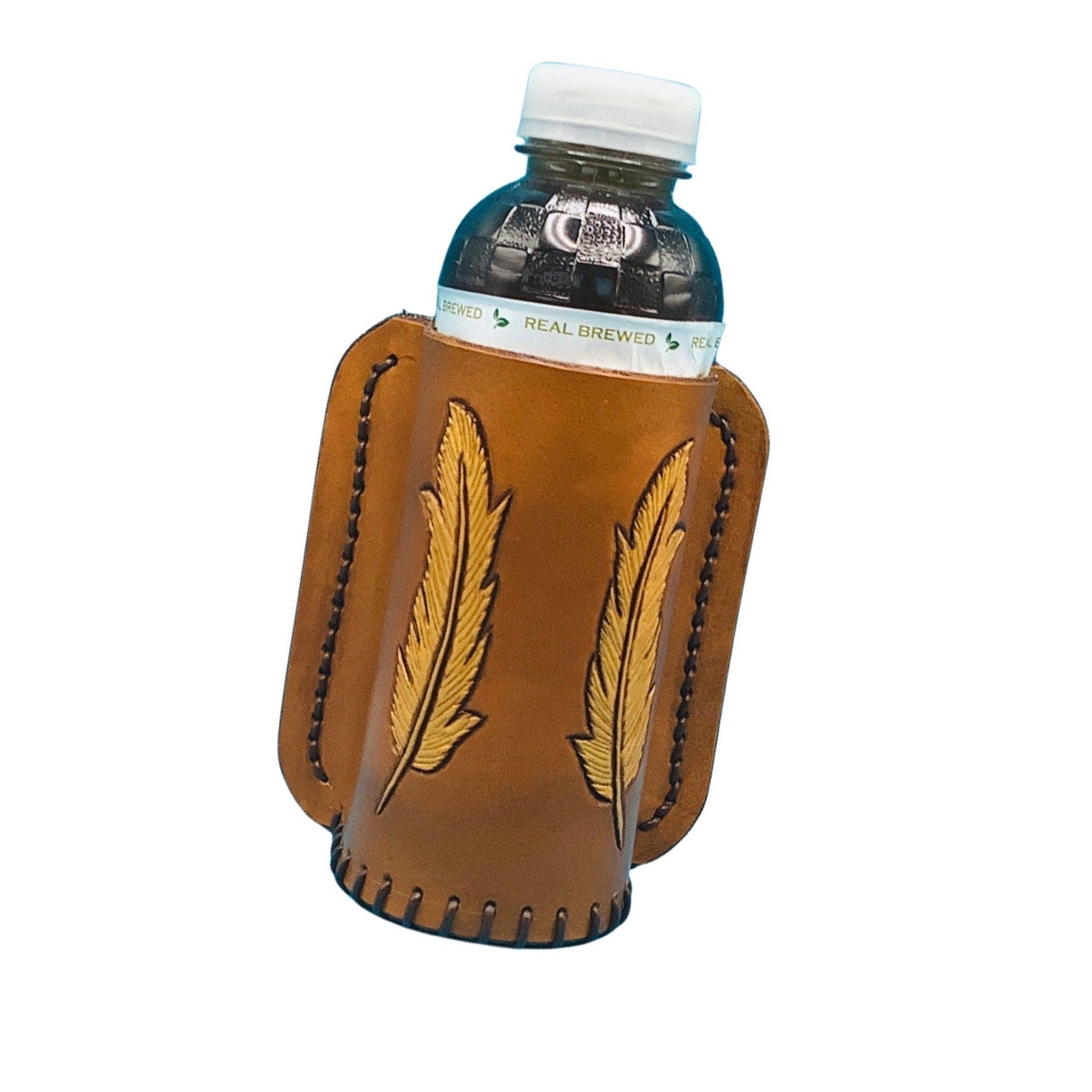 A tan leather bottle holder for saddle rear cinch with hand tooled feathers.