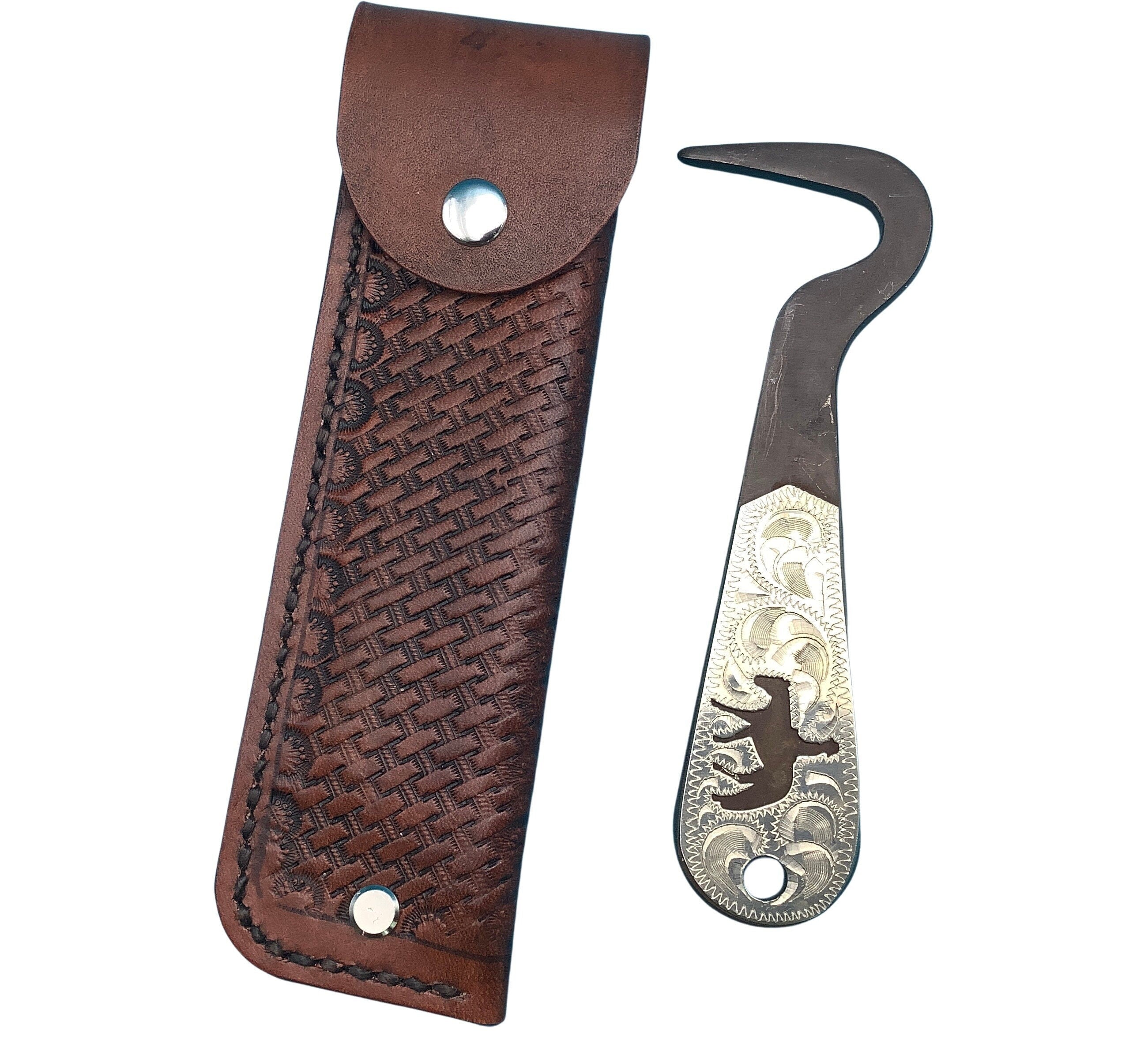 A mahogany basketweave saddle hoof pick holder and a Showman hoof pick with a pleasure horse insert in the handle.