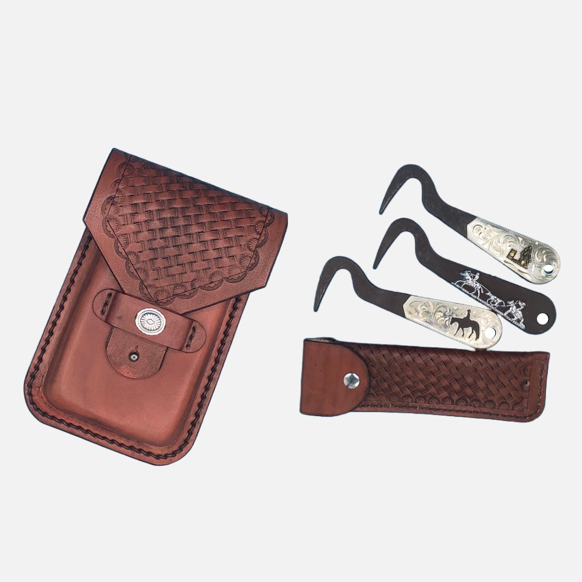 A mahogany basketweave leather phone holder and hoof pick holder for saddle billet strap shown with three Showman hoof picks, a pleasure horse, a barrel racer, and a team roper.