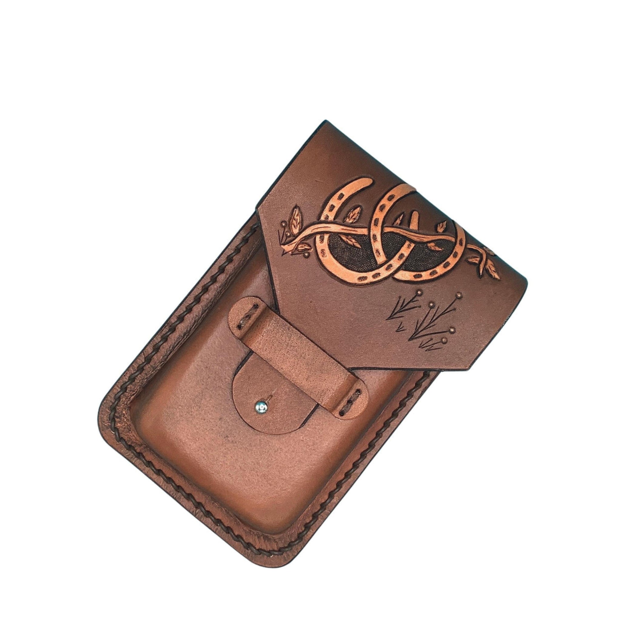 A medium brown phone holder for saddle billet with hand tooled horseshoes.
