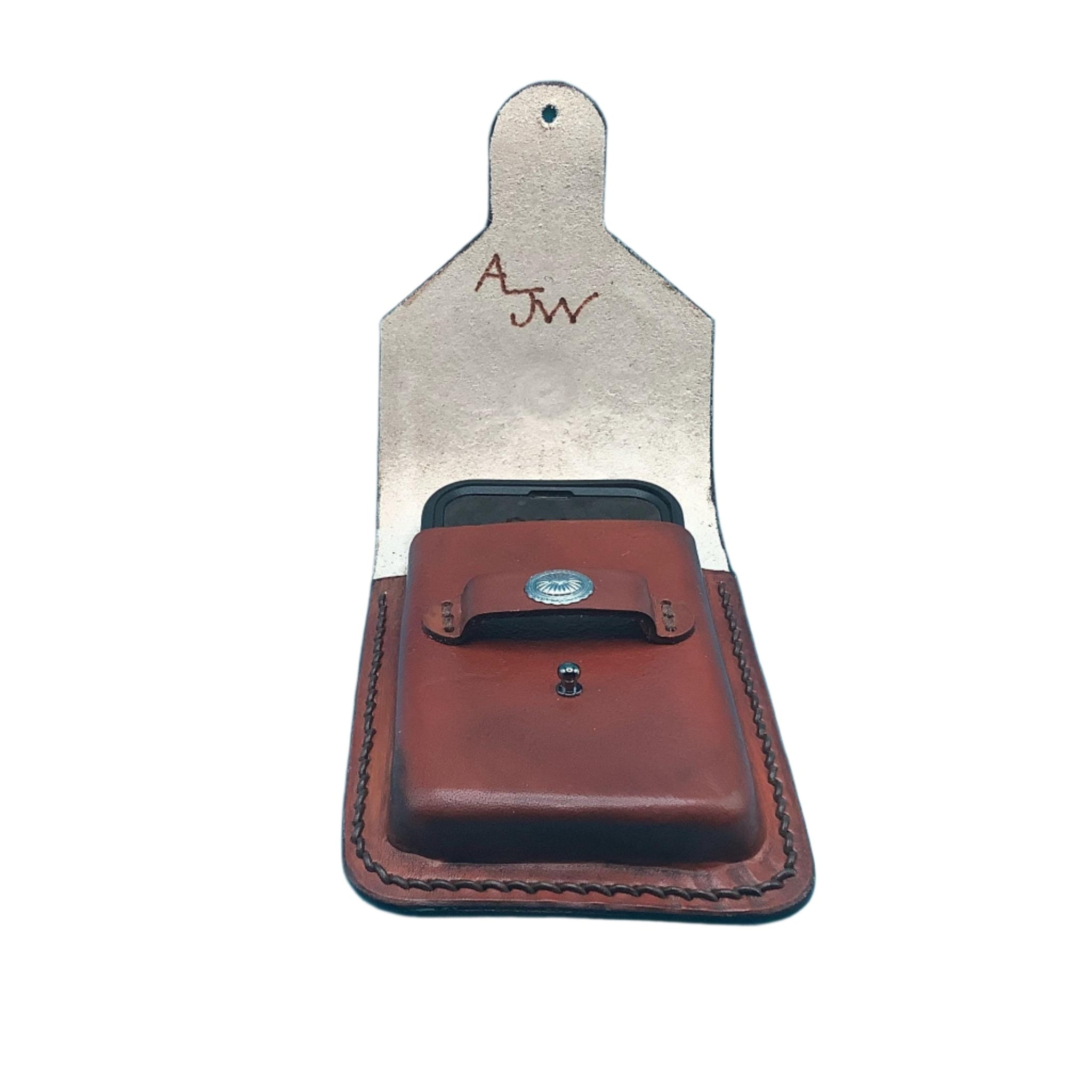 Mahogany leather phone holder for a saddle  with a phone in it.