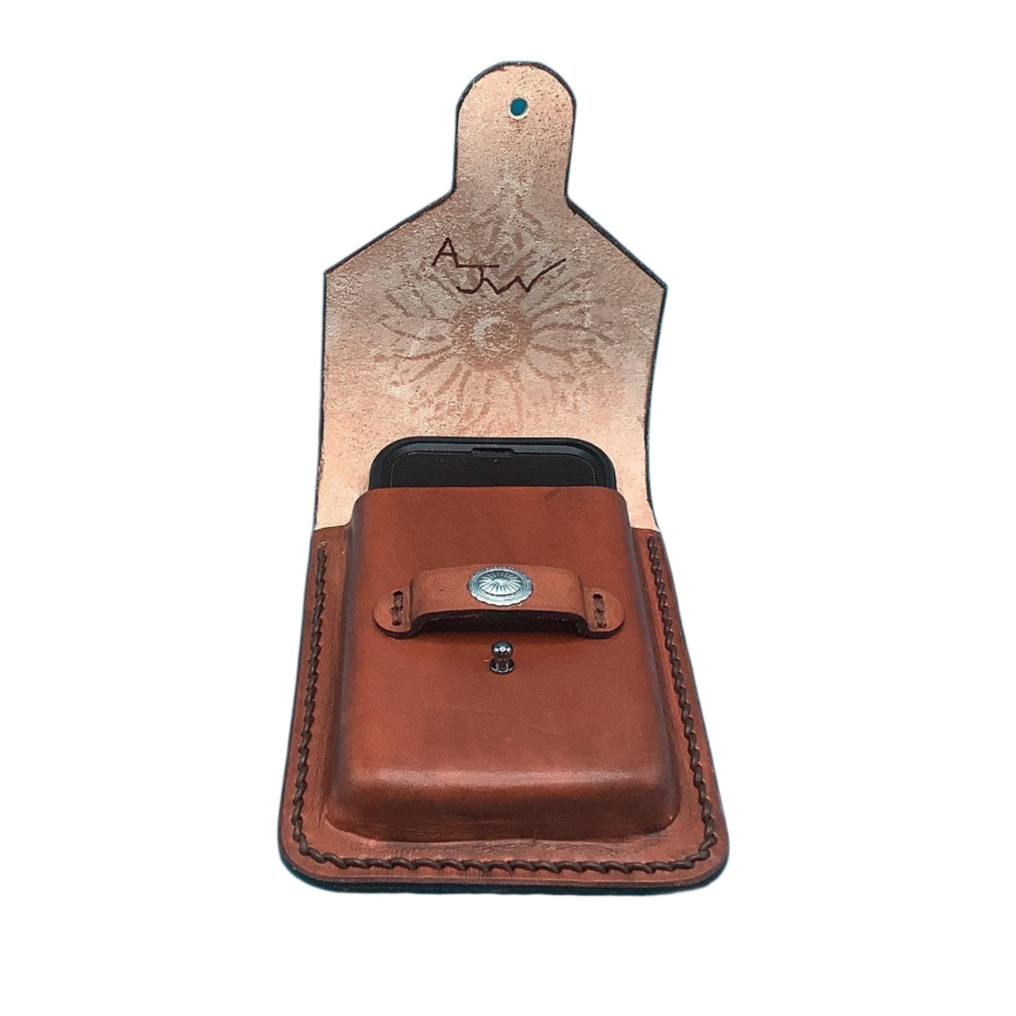An open leather  phone holder for saddle billet strap with a phone in it.